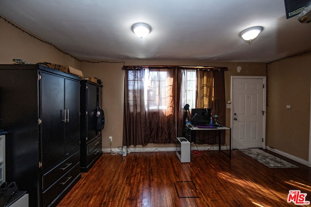 entryway with dark hardwood / wood-style floors