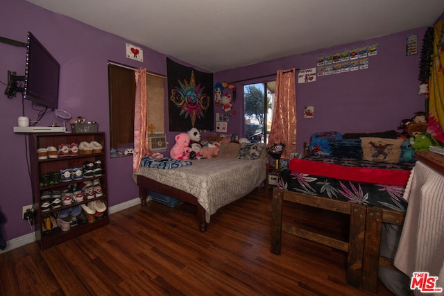 bedroom with hardwood / wood-style flooring