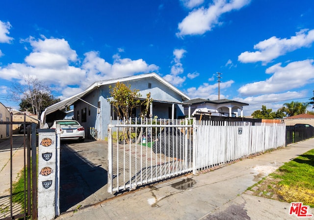 view of front of property with a carport