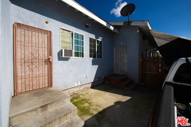 doorway to property with cooling unit