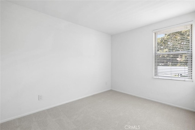 unfurnished room featuring carpet flooring