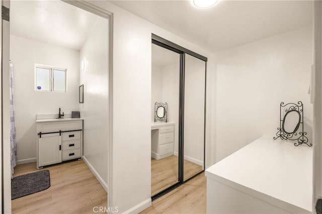 bathroom featuring vanity and hardwood / wood-style floors