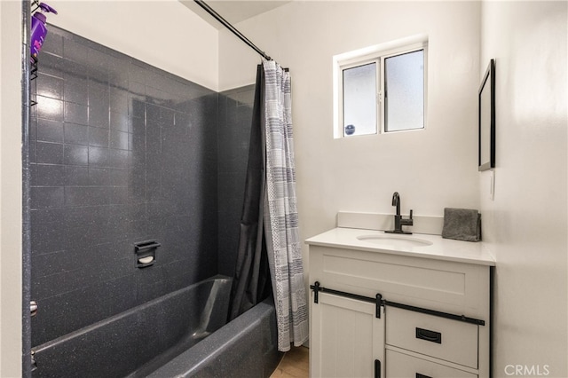 bathroom with shower / tub combo and vanity