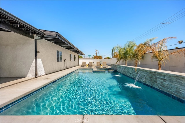 view of pool featuring pool water feature and a patio area