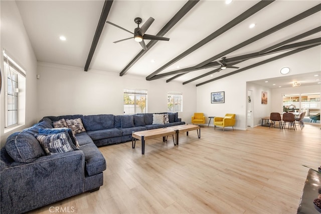 living room with ceiling fan, vaulted ceiling with beams, and light wood-type flooring