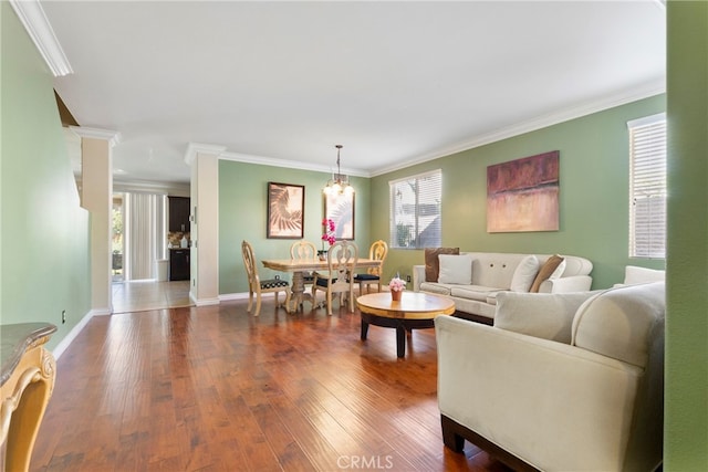 living room featuring hardwood / wood-style flooring and crown molding