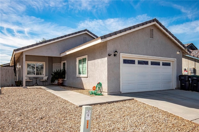 ranch-style home featuring a garage