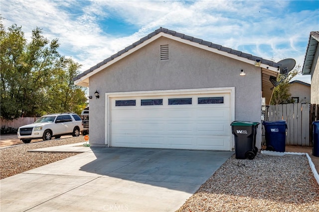 view of side of home with a garage