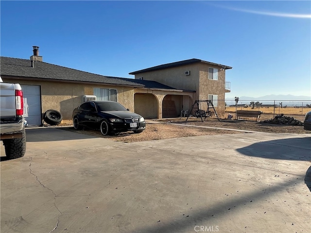 view of property exterior featuring a mountain view