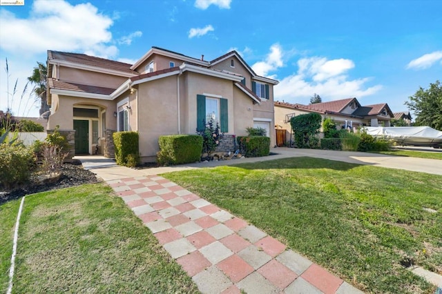 view of front of home featuring a front yard and a garage