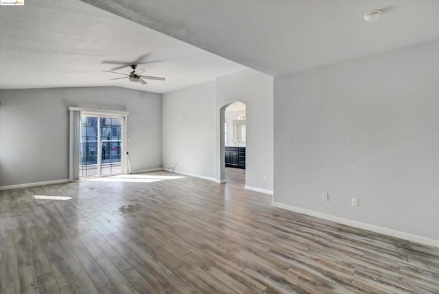 unfurnished room featuring hardwood / wood-style floors, ceiling fan, and lofted ceiling