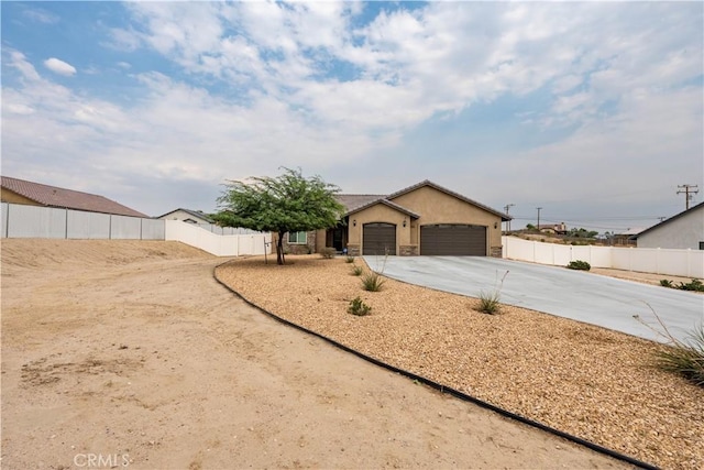 ranch-style home featuring a garage