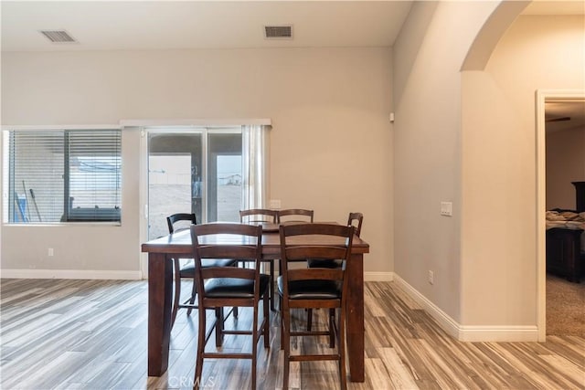 dining area with wood-type flooring