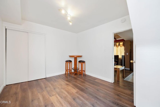 unfurnished room featuring dark hardwood / wood-style floors