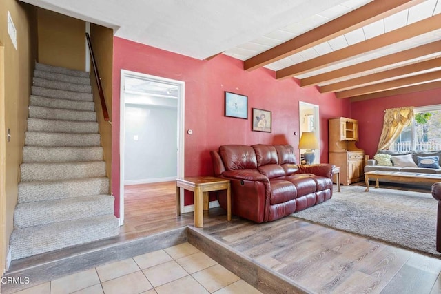 living room with beam ceiling and light hardwood / wood-style flooring