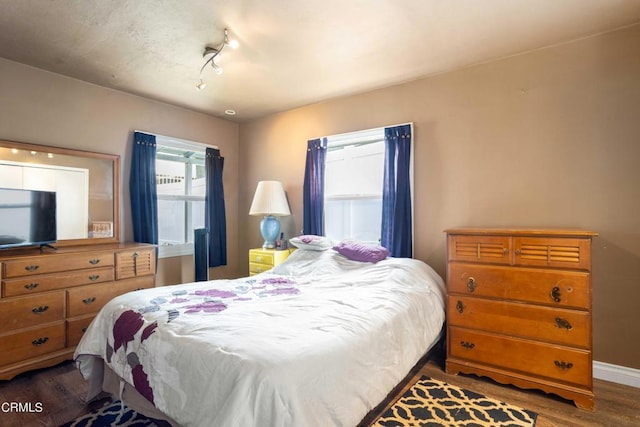 bedroom with wood-type flooring