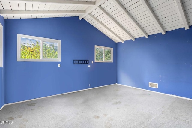 empty room with carpet, vaulted ceiling with beams, and wooden ceiling