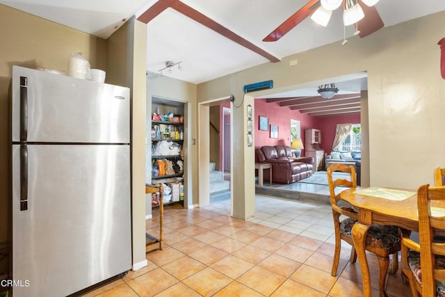 kitchen with ceiling fan, stainless steel fridge, and light tile patterned flooring