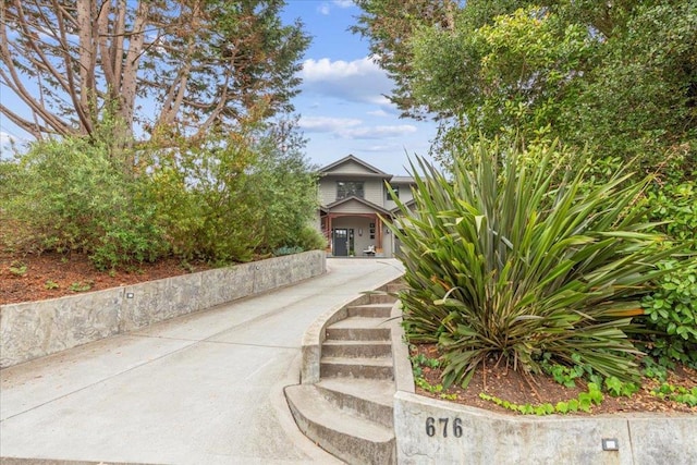 view of property hidden behind natural elements