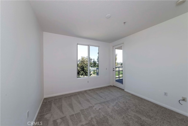 empty room featuring light carpet