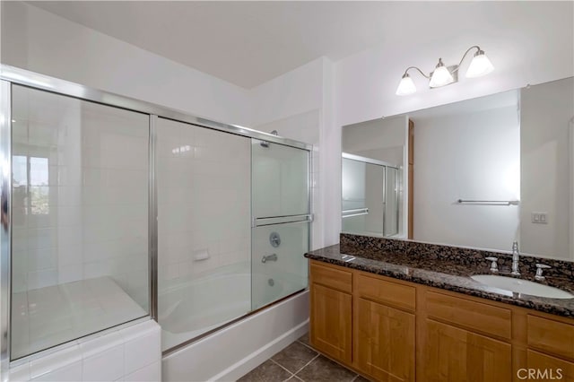 bathroom with enclosed tub / shower combo, vanity, and tile patterned floors