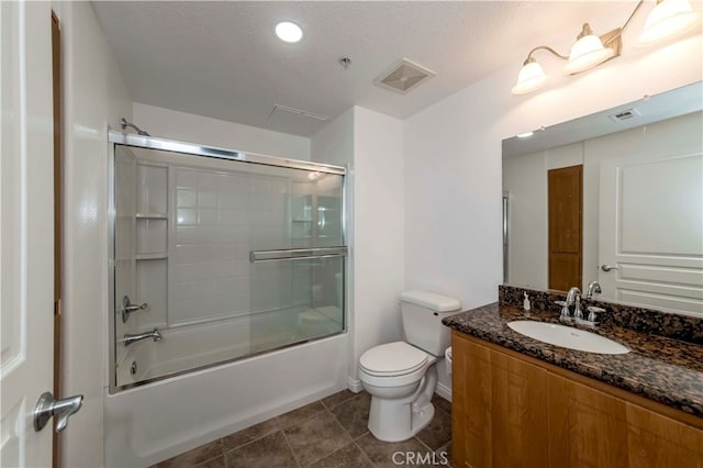 full bathroom with enclosed tub / shower combo, a textured ceiling, vanity, and toilet