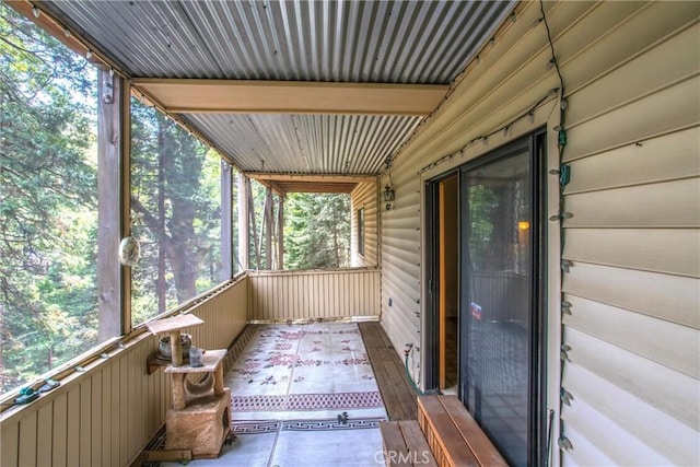 unfurnished sunroom with a wealth of natural light