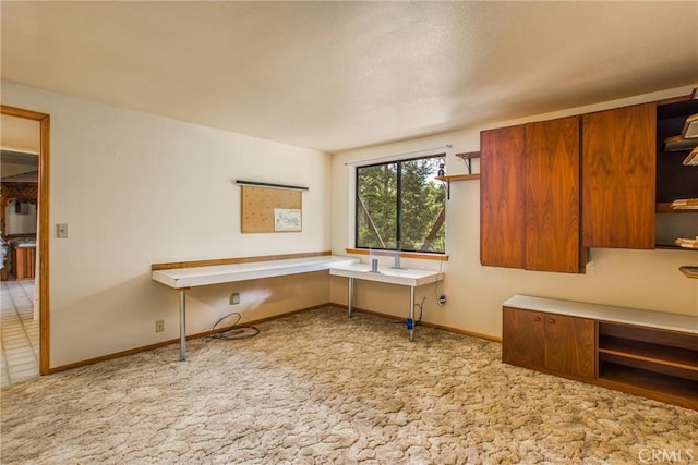 kitchen with light colored carpet