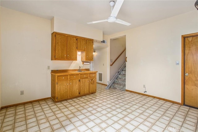 kitchen with ceiling fan and sink