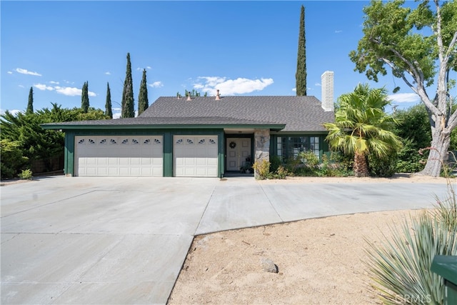 ranch-style home featuring a garage