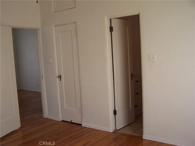 corridor with light wood-type flooring