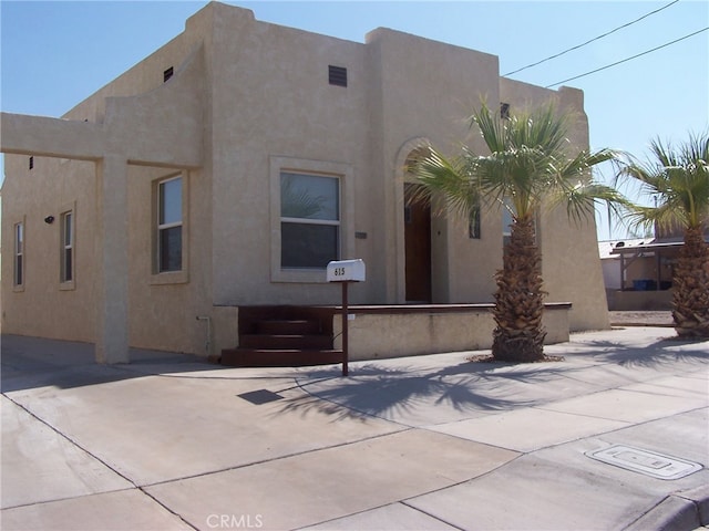 back of house with a patio area