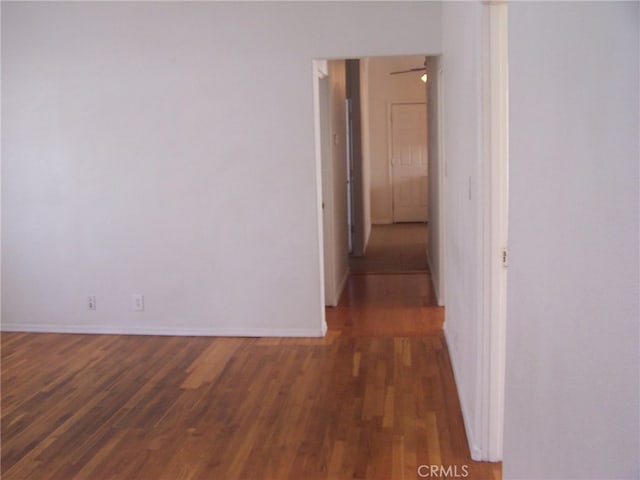 corridor with dark wood-type flooring