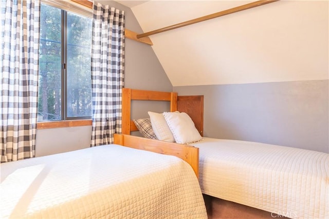 carpeted bedroom featuring vaulted ceiling