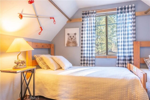 bedroom featuring lofted ceiling