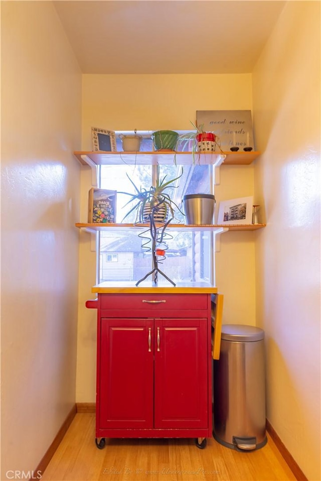 interior details with wood finished floors and baseboards