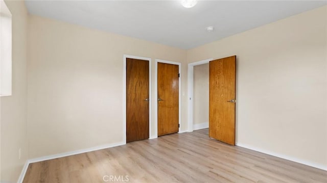 unfurnished bedroom with light hardwood / wood-style floors