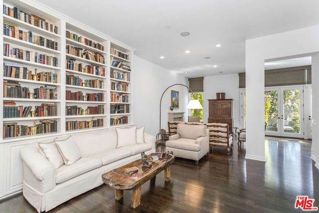 living room featuring french doors and dark hardwood / wood-style floors