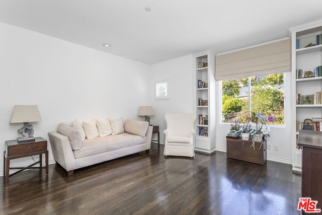 sitting room with dark hardwood / wood-style flooring