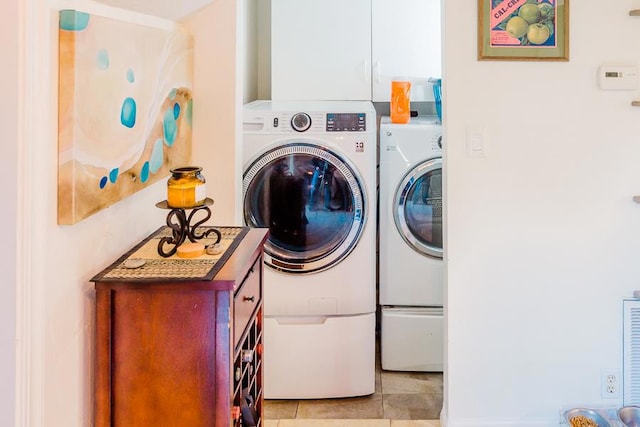 laundry area featuring light tile patterned floors