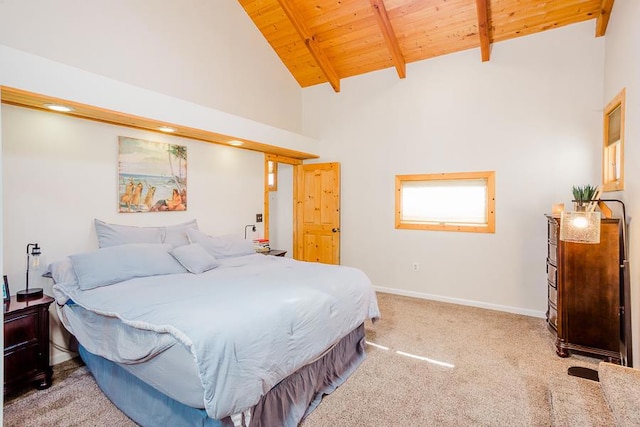 bedroom with high vaulted ceiling, wooden ceiling, carpet, and beam ceiling