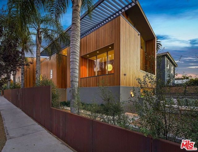 view of property exterior at dusk