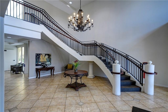 staircase featuring tile patterned flooring and a high ceiling