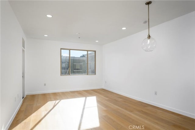 empty room with wood-type flooring