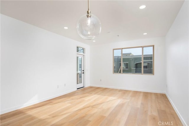 spare room featuring light hardwood / wood-style flooring