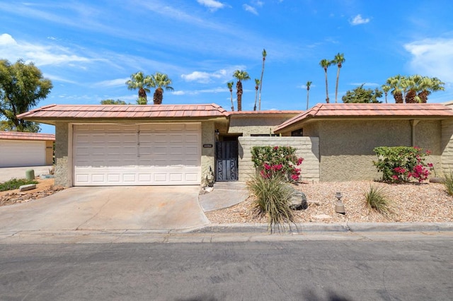 single story home with a garage