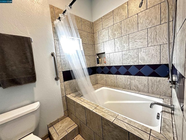 bathroom with toilet and shower / bath combo