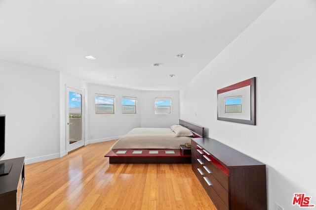 bedroom with light hardwood / wood-style floors