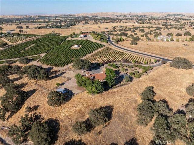 birds eye view of property with a rural view