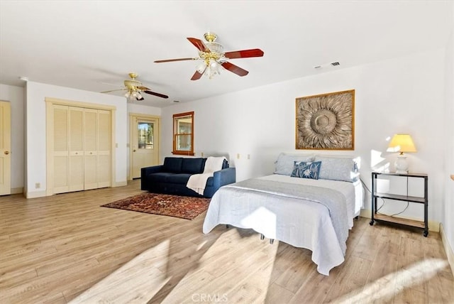 bedroom featuring ceiling fan and light hardwood / wood-style flooring